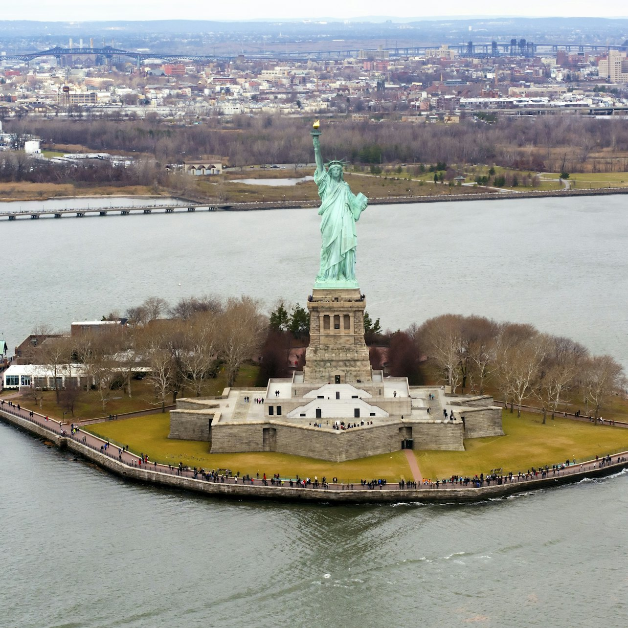 Experience a serene boat ride to Liberty Island where you can stroll around the iconic Statue of Liberty reflecting on its deep historical significance and the freedoms it represents.